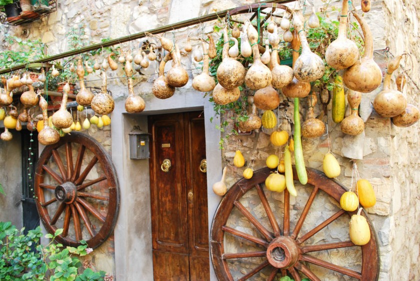Wheels and pumpkins outside a house  | Fabio Caironi/shutterstock.com